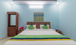 Postel nebo postele na pokoji v ubytování Itsy Hotels Kurinji Stay Inn