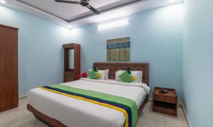 Postel nebo postele na pokoji v ubytování Itsy Hotels Kurinji Stay Inn