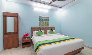 Postel nebo postele na pokoji v ubytování Itsy Hotels Kurinji Stay Inn + 24 fotografií
