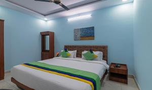 Postel nebo postele na pokoji v ubytování Itsy Hotels Kurinji Stay Inn