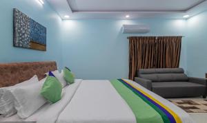 Postel nebo postele na pokoji v ubytování Itsy Hotels Kurinji Stay Inn