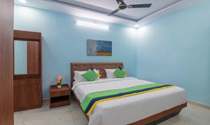 Postel nebo postele na pokoji v ubytování Itsy Hotels Kurinji Stay Inn