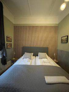 Postel nebo postele na pokoji v ubytování Lilla Hotellet