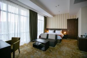Кровать или кровати в номере Citrus Hotel