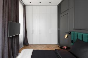 En eller flere senger på et rom på Luxury Apartment con terrazzo su Piazza Oberdan