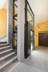 a hallway of a building with a door and stairs at Luxury Apartment con FREE PARK in Trieste