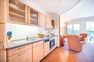 a kitchen with a sink and a counter top at Ferienwohnung Margaretha, App 18 in Ostseebad Sellin