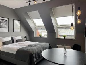 Postel nebo postele na pokoji v ubytování Forenom Aparthotel Lund
