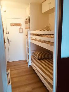 a small room with two bunk beds in it at Studio Saint Cyr sur mer,Vue mer in Saint-Cyr-sur-Mer