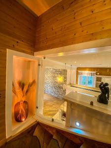 a room with a window with a vase on a shelf at Luxusvilla Österreich in Scheibbs
