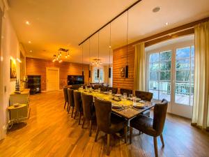 a large dining room with a long table and chairs at Luxusvilla Österreich in Scheibbs