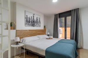 Ένα ή περισσότερα κρεβάτια σε δωμάτιο στο AB Besòs River Apartment