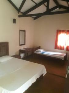 Ένα ή περισσότερα κρεβάτια σε δωμάτιο στο Ralapela Eco Bungalow