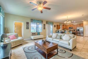 a living room with a couch and a ceiling fan at Southern Comfort in Davenport