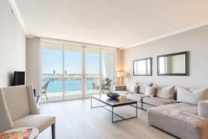 a living room with a couch and a table at Golden Bay 808 in Miami Beach