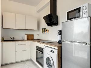 Kuchyň nebo kuchyňský kout v ubytování Le 121 - Appartement 101 + 8 fotografií