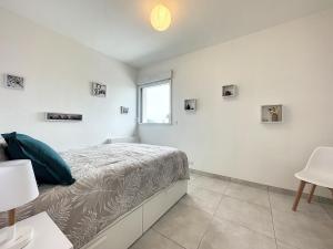 Postel nebo postele na pokoji v ubytování Le 121 - Appartement 101