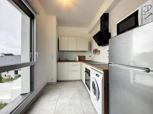Kuchyň nebo kuchyňský kout v ubytování Le 121 - Appartement 101