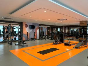 a gym with exercise equipment in a building at 1BHK in Hiranandani Powai B in Mumbai