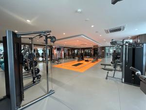 a gym with treadmills and machines in a building at 1BHK in Hiranandani Powai B in Mumbai