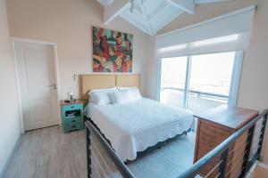 Postel nebo postele na pokoji v ubytování La Santina Posada & Experiencias de Campo + 76 fotografií