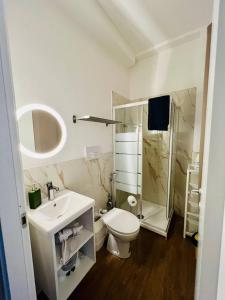 a bathroom with a toilet and a sink and a shower at La Dimora degli Artisti in Pescara