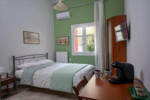Ένα ή περισσότερα κρεβάτια σε δωμάτιο στο Delphian Colors - Green Edition