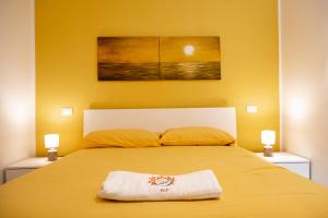Postel nebo postele na pokoji v ubytování SUN & MOON B&B