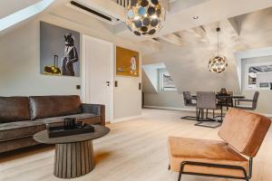 a living room with a couch and a table at Odda Panorama in Odda