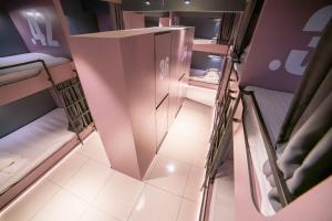 an overhead view of a room with a small refrigerator at Homy Seafront Hostel in Kota Kinabalu +198 photos