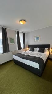 Ένα ή περισσότερα κρεβάτια σε δωμάτιο στο Hotel Boston