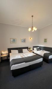 Ένα ή περισσότερα κρεβάτια σε δωμάτιο στο Hotel Boston