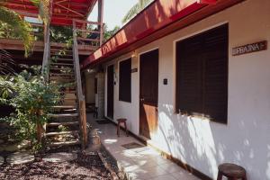 a building with a stairway next to a house at Pacific Buddha in Brisas de Zicatela +12 photos