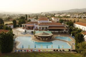 an aerial view of a resort with a swimming pool at Akamanthea Holiday Village in Polis Chrysochous