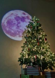 a christmas tree with a moon in the background at Seoul National University Apartment in Seoul