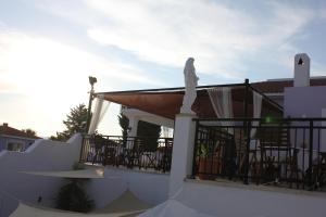 a statue on the roof of a house at Akamanthea Holiday Village in Polis Chrysochous