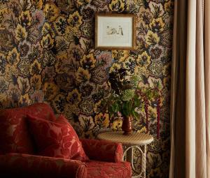 a living room with a vase of flowers on a wall at Marine North Berwick in North Berwick