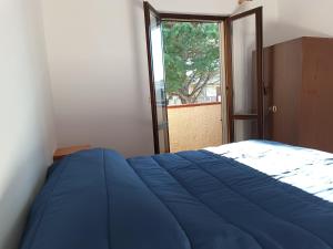 Cama ou camas em um quarto em Villaggio La Bahia