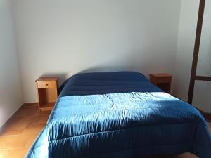 Villaggio La Bahia tesisinde bir odada yatak veya yataklar