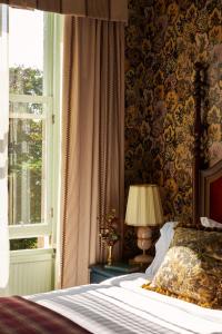 a bedroom with a bed and a window at Marine North Berwick in North Berwick