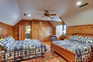 a bedroom with two beds and a ceiling fan at Lakefront Custom-Built Mentone Home Game Room! in Mentone