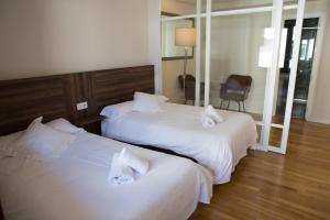 Posteľ alebo postele v izbe v ubytovaní Hotel Mogay