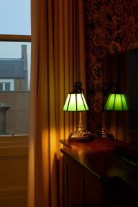 two lamps sitting on a dresser next to a window at Marine North Berwick in North Berwick