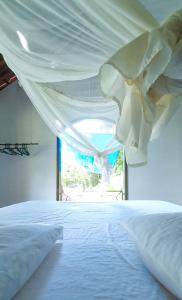 Postel nebo postele na pokoji v ubytování Bed&Breakfast em Paraiso Sitio Alambique, Morro de Sao Paulo