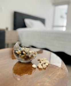 a glass bowl filled with nuts on a wooden table at Barranco Piso 18 Vista al mar piscina Jacuzzi gym in Lima