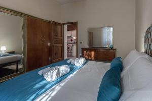 a bedroom with a bed with two pillows on it at Relax in San Frediano con giardino in Florence