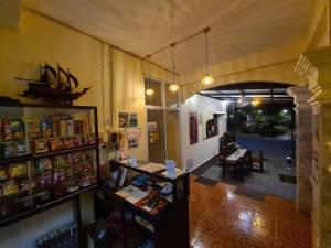 a room with a store with a counter in it at Saphaothong guesthouse in Vang Vieng
