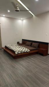 a bedroom with a large bed in a room at Private entire 3 bedroom portion in Islamabad in Islamabad