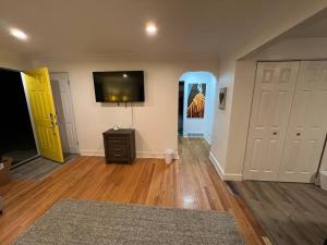 a living room with a tv on the wall at 2 bedroom in Denver, Centralized in Denver
