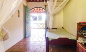 Postel nebo postele na pokoji v ubytování Bed&Breakfast em Paraiso Sitio Alambique, Morro de Sao Paulo